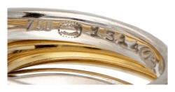 18 kt. Witgouden no.1314 'Magic' ring door Regitze Overgaard en een geelgouden Georg Jensen ring bezet met ca. 0.58 ct. diamant.