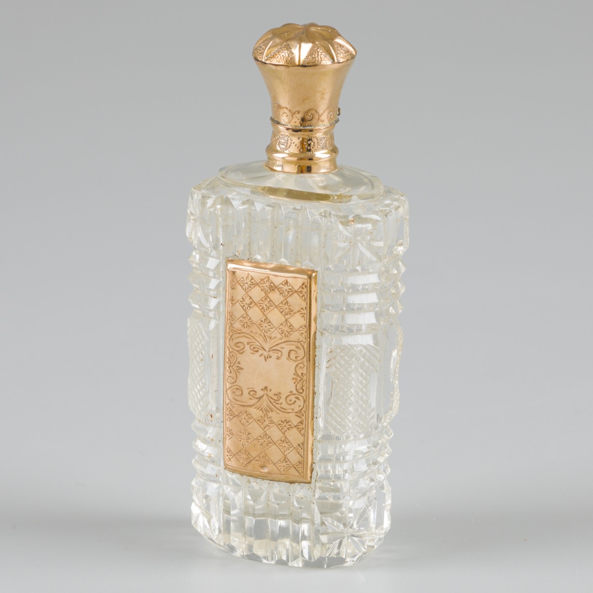 Parfumflacon goud.