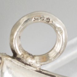 Rammelaar zilver.