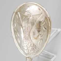Rammelaar zilver.