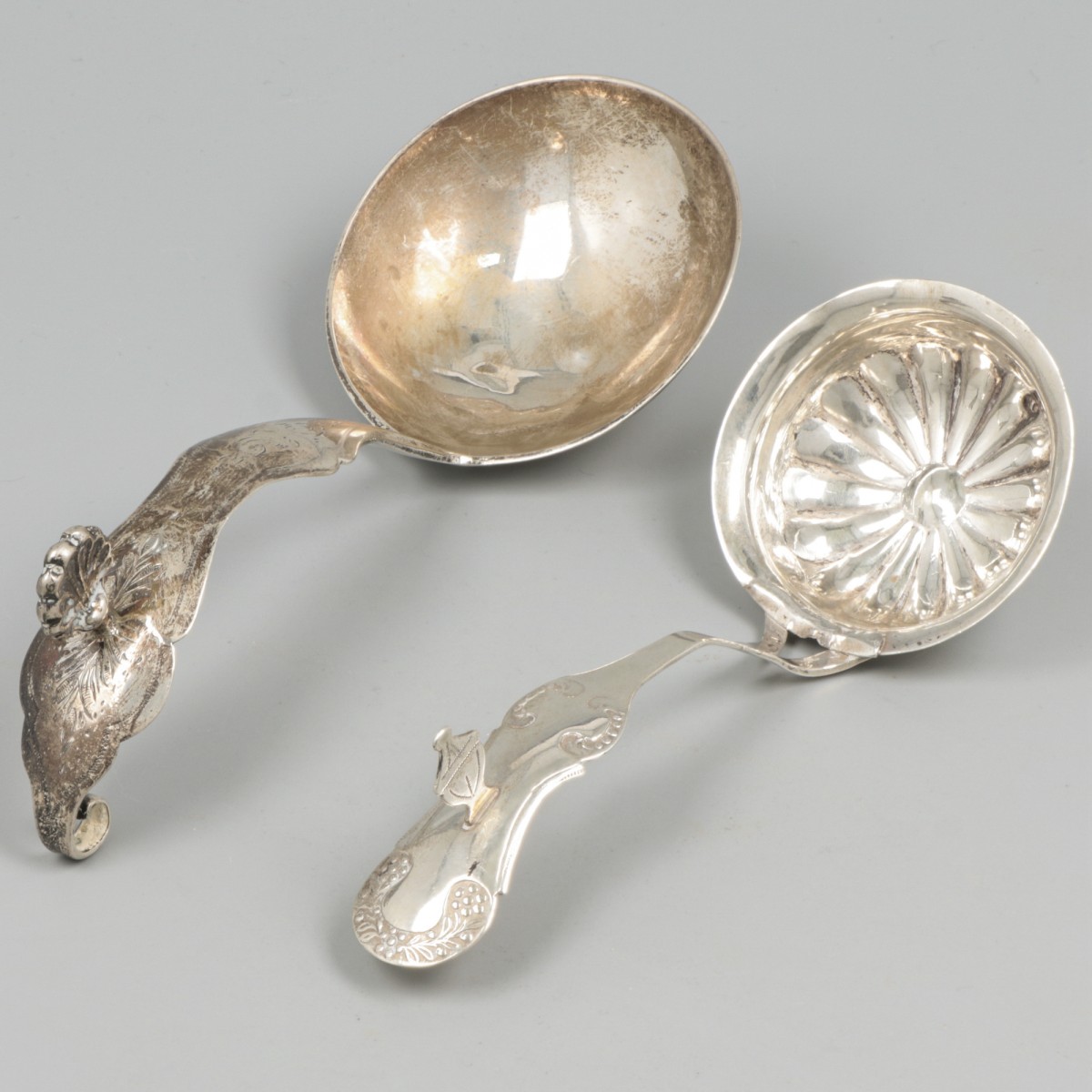 2-delig lot roomlepels zilver.