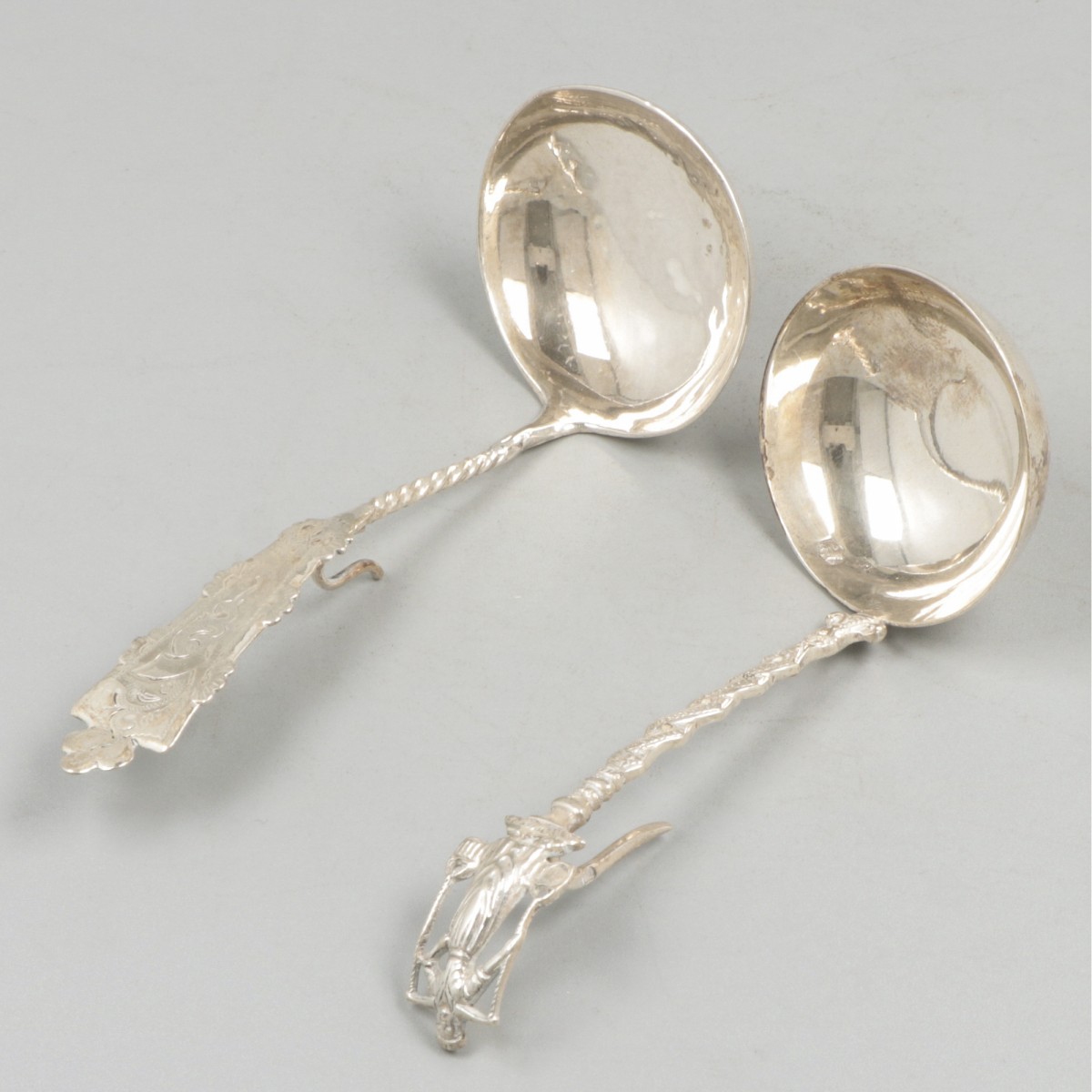 2-delig lot roomlepels zilver.