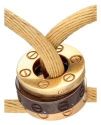 Cartier 'Love Cord' armband van beige zijden koord met drie ringen en diamant.