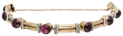 Vintage 14 kt. geelgouden armband bezet met diamant en granaat.