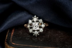 Vintage 14 kt. geelgouden entourage ring bezet met ca. 1.68 ct. diamant in zilver.