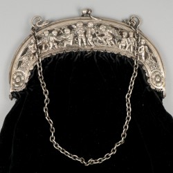 Beugeltas zilver.