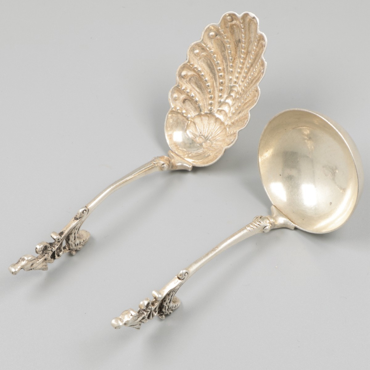 2-delig lot roomlepels zilver.