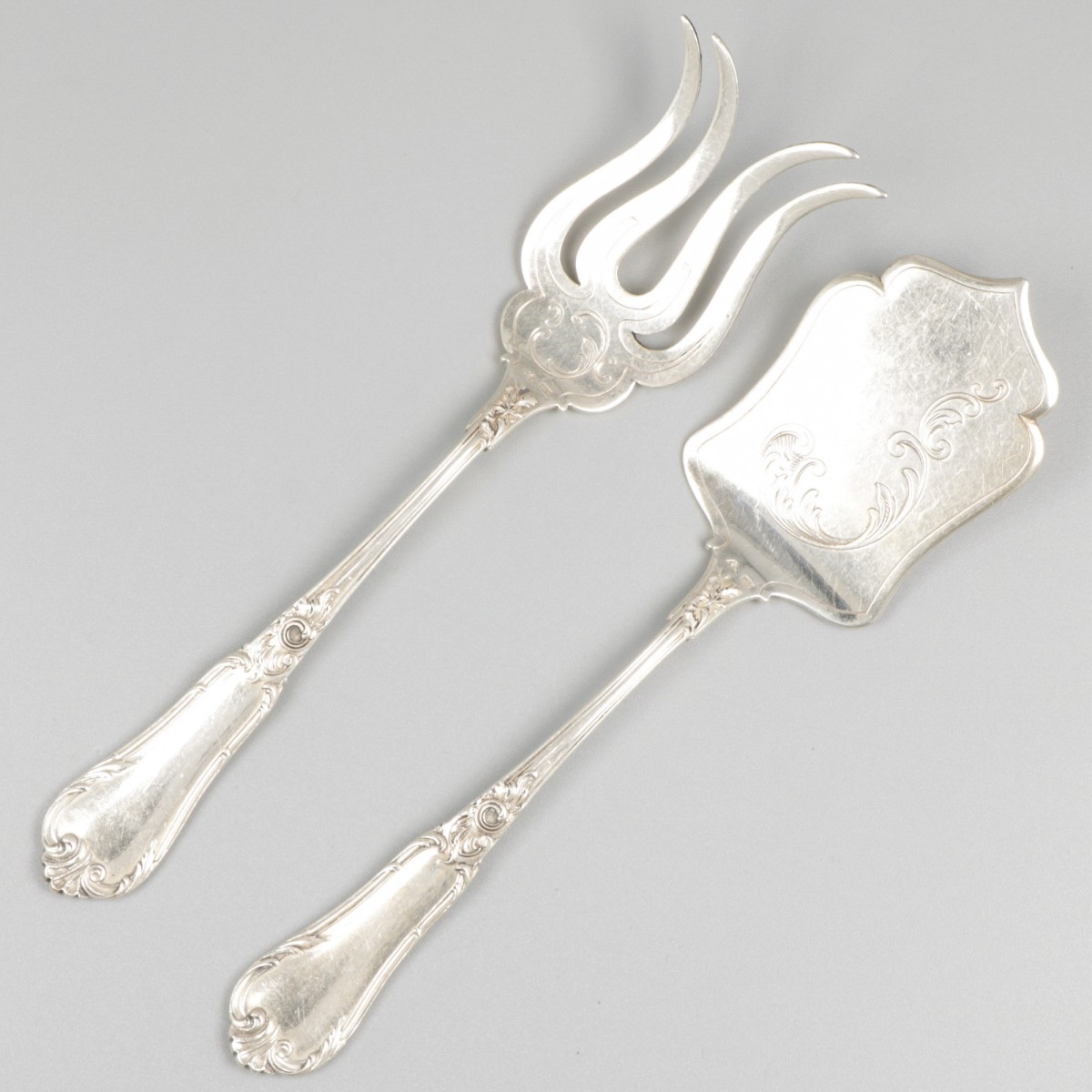 Kaasschep en sardinevork zilver.