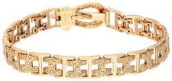 Vintage 18 kt. geelgouden armband met gespsluiting bezet met ca. 0.74 ct. diamant.