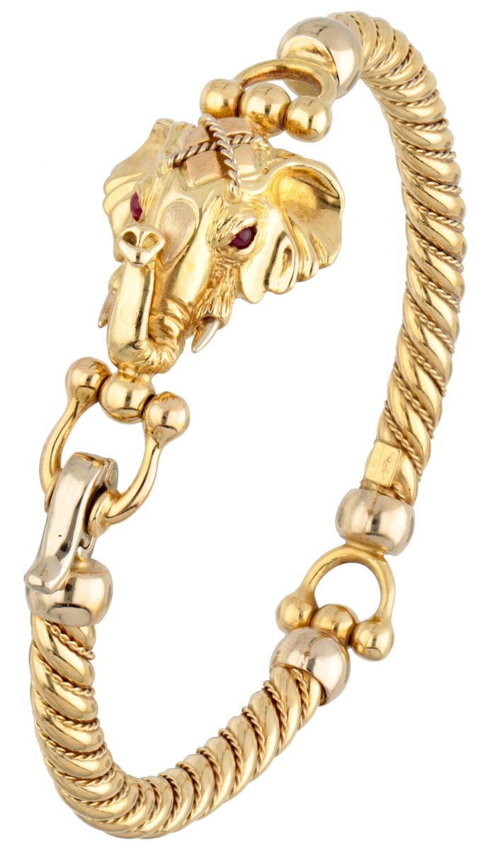 Vintage 18 kt. geelgouden bangle armband met voorstelling van een olifant kop bezet met robijn.